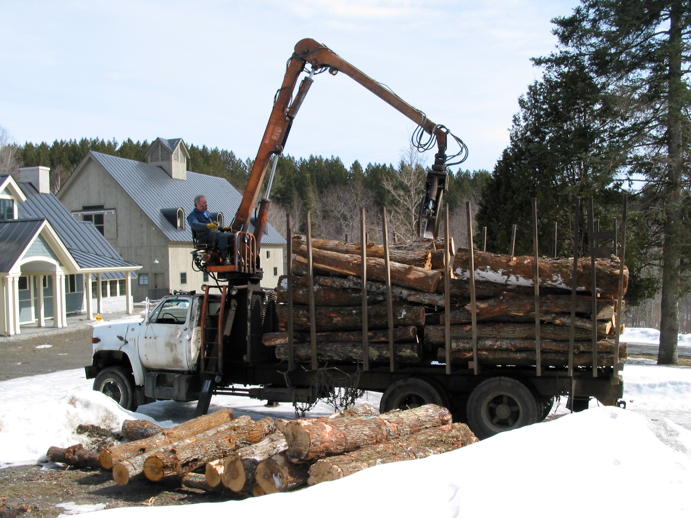 Log Truck brings logs from "back yard" to "front door" of Beaver Brook Farm